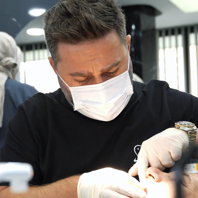 Dr. Hüseyin Aşçı during treatment